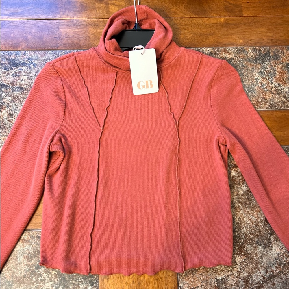 New with tags brown/orange GB sweater. Size M never worn